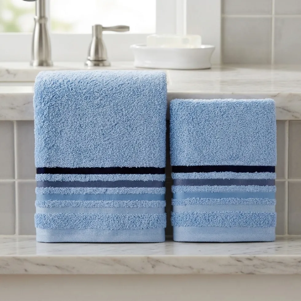 Set asciugamani viso + ospite in spugna azzurro cielo con righe jacquard