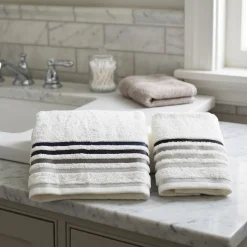 Set 1+1 bianco con bordo a righe grigio viso + ospite in spugna